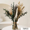 A bouquet of natural dried eucalyptus and grasses tied together