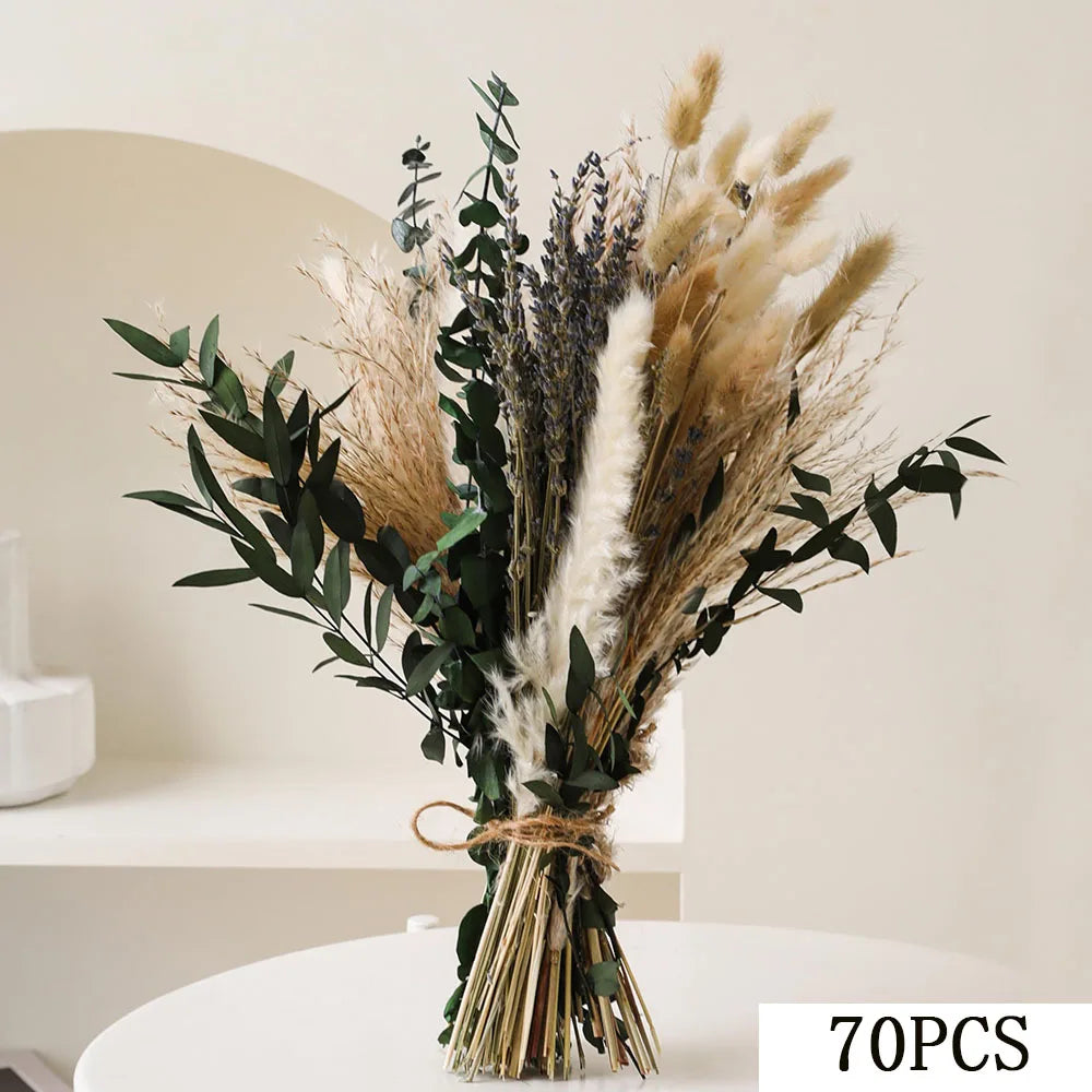 A bouquet of natural dried eucalyptus and grasses tied together