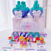A collection of My Little Pony Magic Bottle collectible figurines in various colors and sizes displayed on a pink box.
