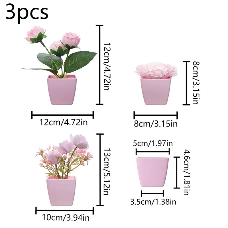 Three small pink faux bonsai plants in various pot sizes and heights for home decor