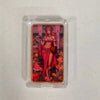 A fantasy art bar featuring a woman in pink attire and elaborate hair, displayed in a clear protective case.