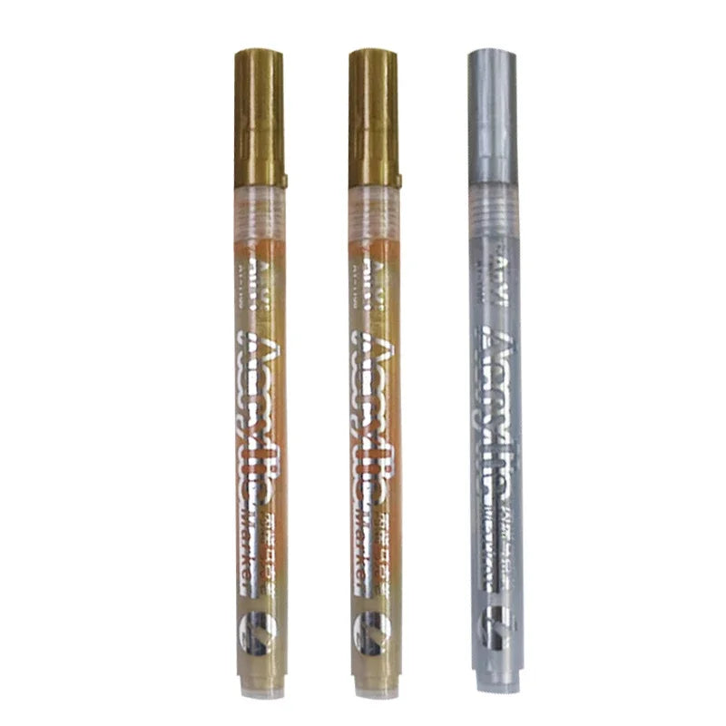 Three Extra-Fine Point Acrylic Paint Pens in gold and silver packaging.