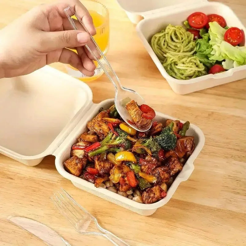 A hand is using a spoon to serve a savory meat and vegetable dish in an open plastic container.