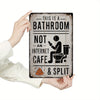 A weathered metal sign reads This is a bathroom not an internet cafe & split, held by a hand.