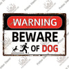 A vintage warning metal sign with a red top and white body that reads WARNING BEWARE OF DOG