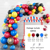 A balloon garland arch kit featuring various colored balloons and star foil accents displayed against a white brick wall.