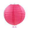 A large, round pink paper lantern used for parties and weddings.