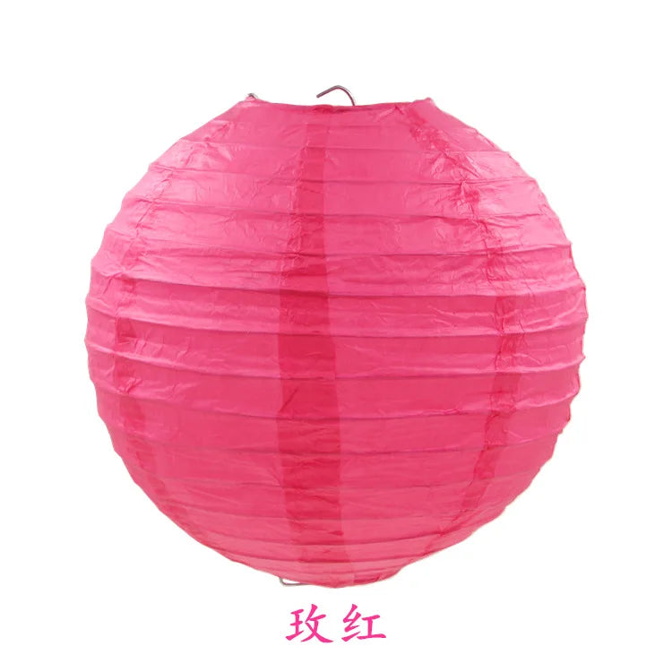 A large, round pink paper lantern used for parties and weddings.
