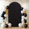 A dark gray arch backdrop decorated with white and gold balloons for a wedding or party event.