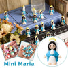 A collection of small Maria figurines in various colors and poses displayed on a blue book.