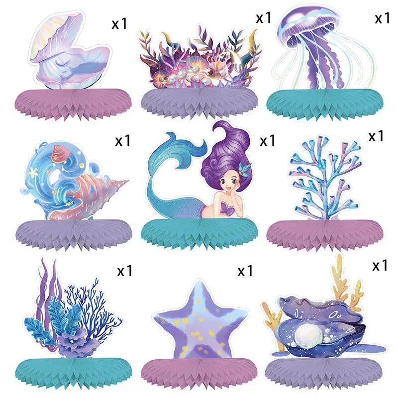 A set of mermaid-themed tableware featuring purple and blue sea creatures, including a mermaid figure and starfish.