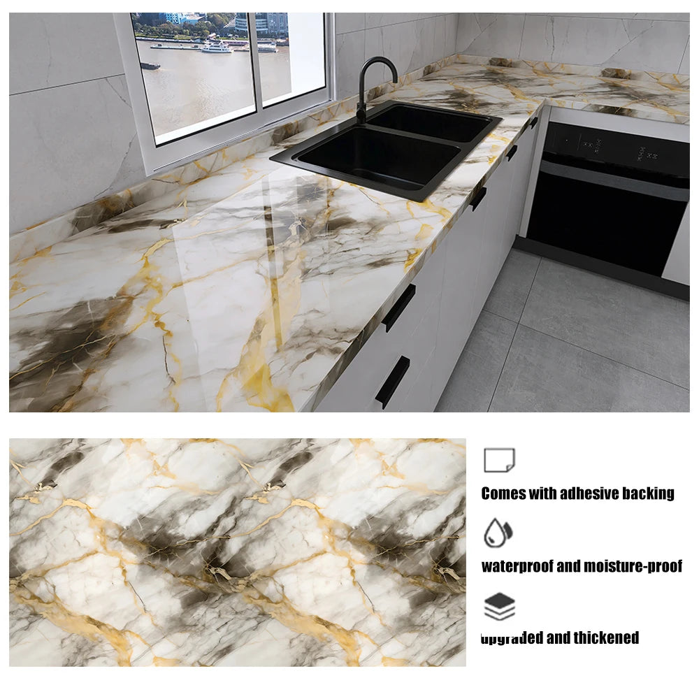 A kitchen countertop featuring a marble pattern with gold veining, installed with an adhesive backing.
