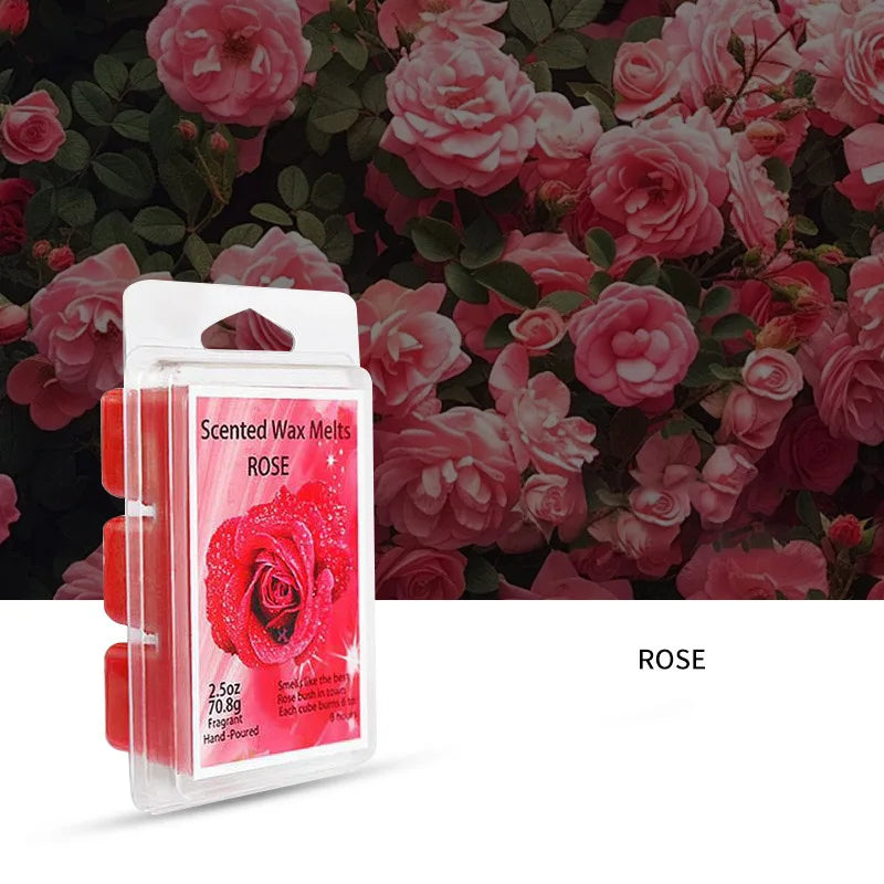 A clear plastic package of scented wax melts in a rose color set against a background of pink roses and green leaves.