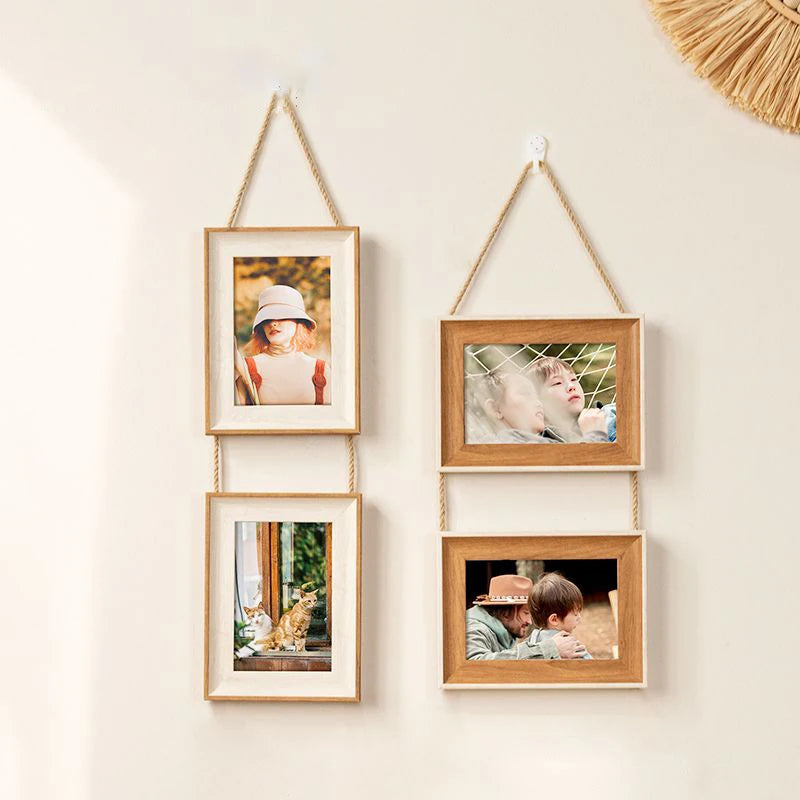 A set of four rustic wooden collage photo frames with gold string hangers displaying various pictures.