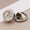 Silver rhinestone buttons with a pearl center are shown on a light background.
