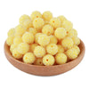A pile of small, yellow textured resin beads for jewelry making in a wooden bowl.