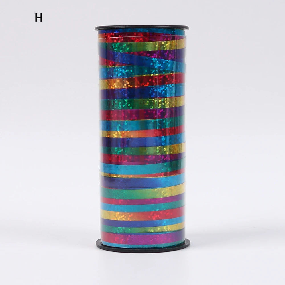 A cylindrical roll of glitter curling ribbon featuring horizontal stripes in various bright colors.