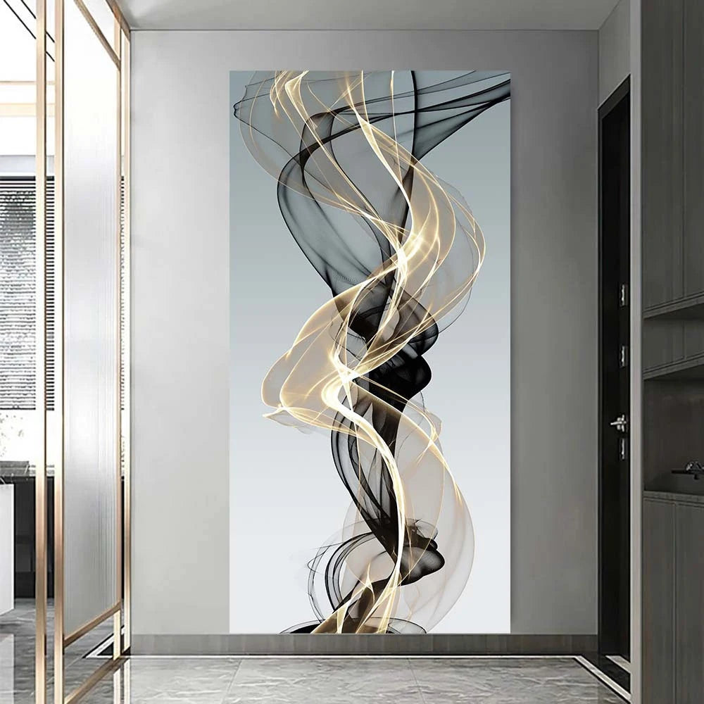 Abstract wall art featuring swirling ribbons of black and gold on a light gray background.