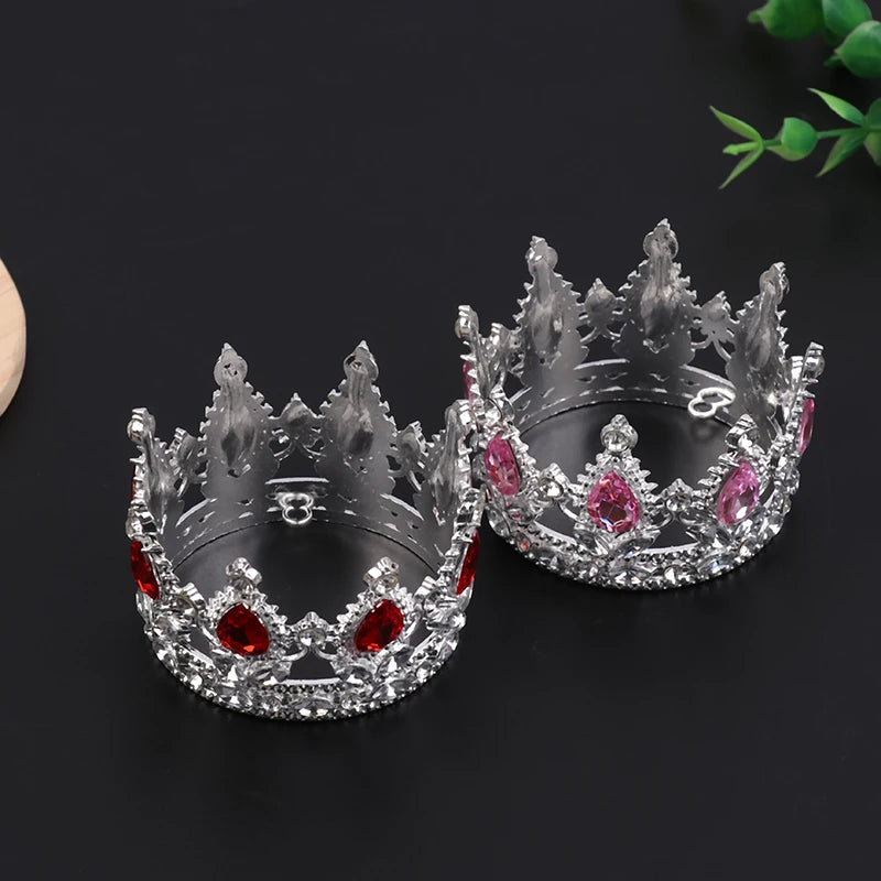 Silver tiara crown cake topper and hair accessory decorated with pink and red gemstones