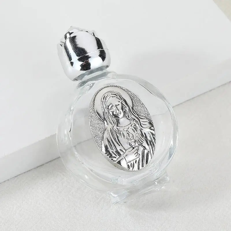 Decorative glass bottle with a silver figurine and twist cap