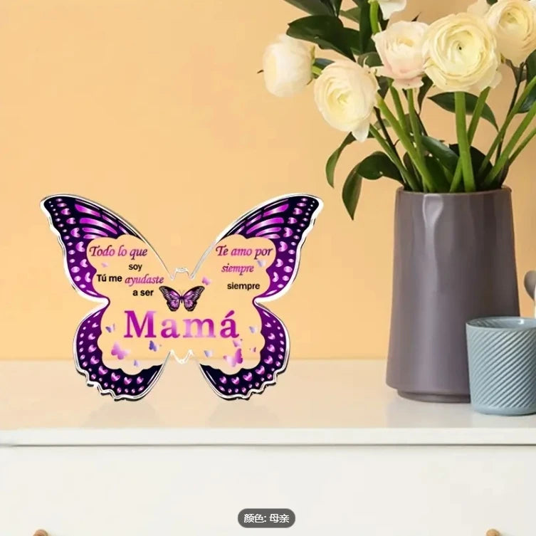 A purple butterfly acrylic keepsake plaque with text for mom displayed on a white surface.