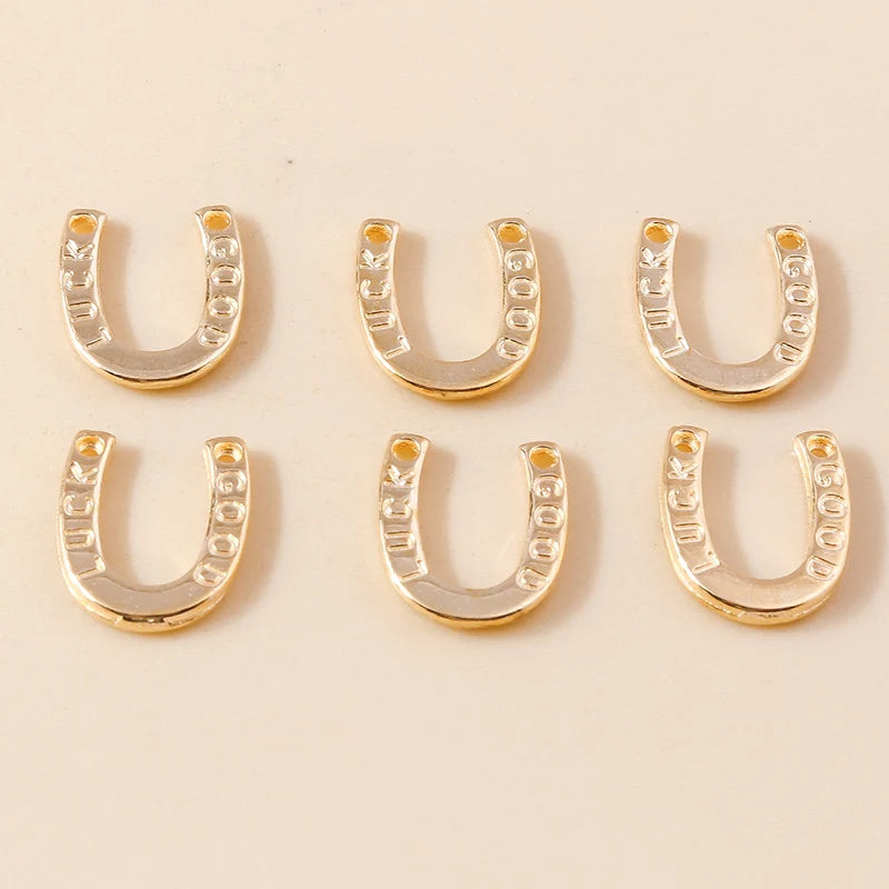 A set of gold horse charm pendants for handmade jewelry displayed on a light background.