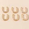 A set of gold horse charm pendants for handmade jewelry displayed on a light background.