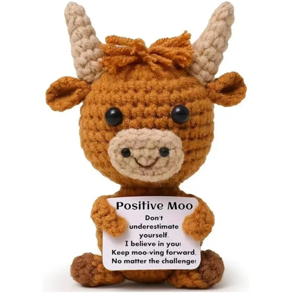 A crocheted Highland cow keychain keepsake in a warm brown color.