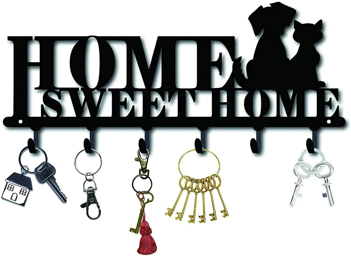Decorative metal wall-mounted key holder with seven hooks and various keys.