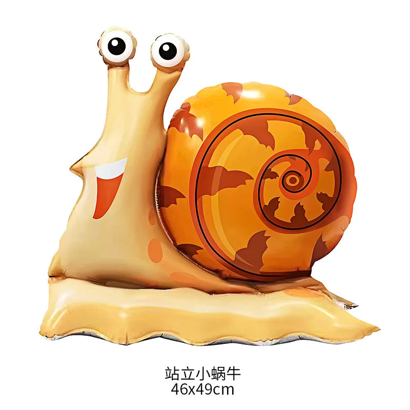 A realistic inflatable decoration of a baby giraffe and a large orange tortoise for birthday parties