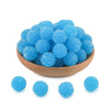 A bowl filled with bright blue textured resin beads for jewelry making