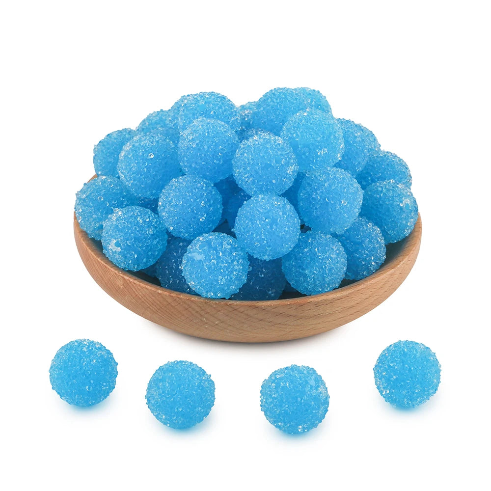 A bowl filled with bright blue textured resin beads for jewelry making