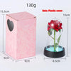 Pinke Box mit Glasvase, roter Rose und blauem Wasser als LED-Dekoration.