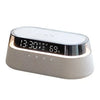 A modern, silver-colored wireless charging speaker lamp with a digital display showing time and battery percentage.