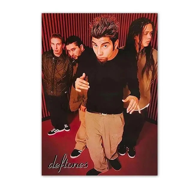 A concert poster featuring the band Deftones with three members in dark clothing against a red background.