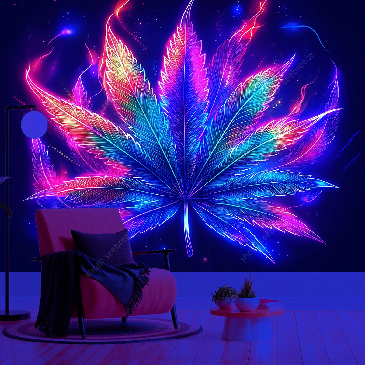 A vibrant neon cannabis leaf tapestry hangs on a dark wall above a chair.