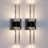 Modern bubble crystal LED wall sconces mounted on a white wall.