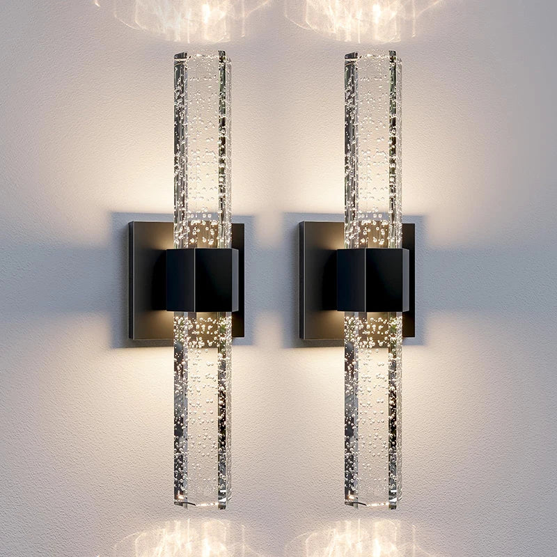 Modern bubble crystal LED wall sconces mounted on a white wall.