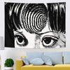 A black and white tapestry wall hanging featuring a stylized close-up of an eye and surrounding hair.