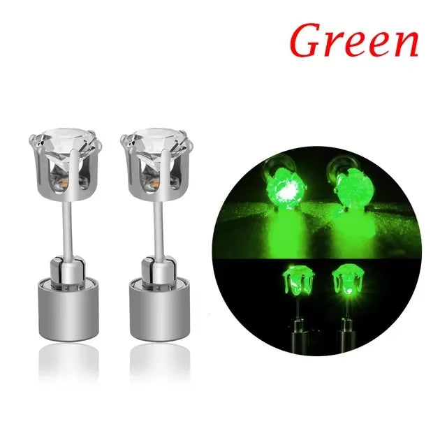 A pair of silver LED light-up flashing stud earrings with color-changing zircon stones shown against a dark background.