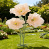 Large artificial silk peach colored poppy flower with green stand in a garden setting