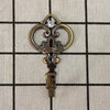 Vintage gold-toned crown curtain hooks with a clear gemstone detail