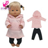 A baby doll wearing a pink hoodie and pants with a matching hat.