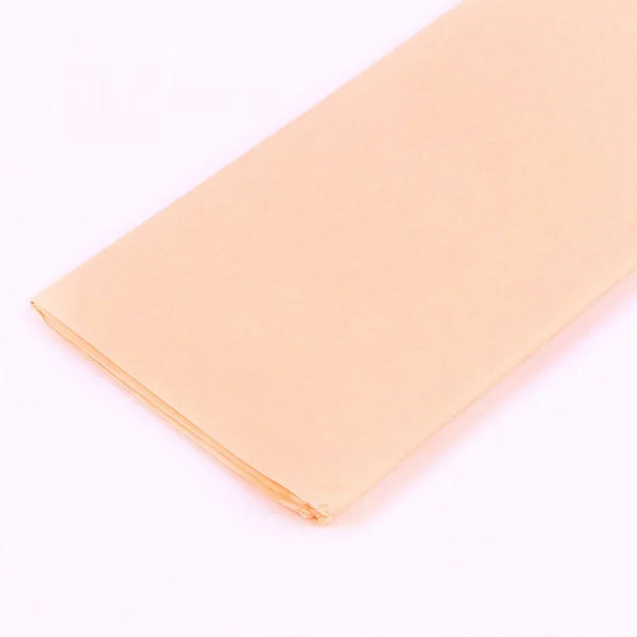 A sheet of pale peach colored soft tissue paper for gift wrapping or DIY crafts.