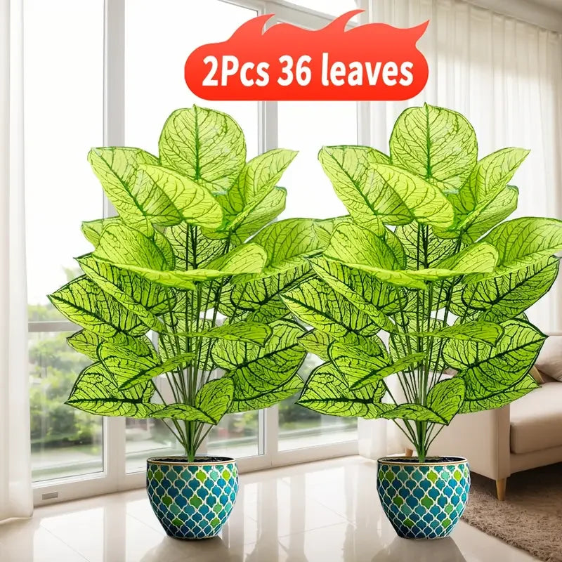 Two artificial floor plants with green leaves in blue pots displayed indoors near a window.
