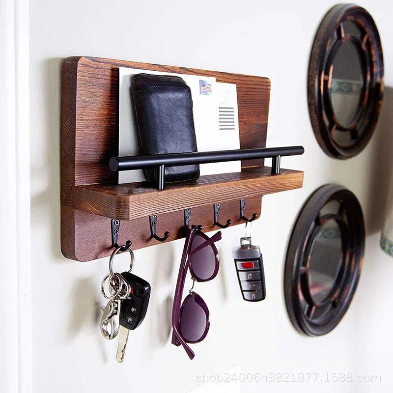 Rustic wooden wall key holder featuring a shelf and seven hooks for hanging keys and sunglasses.
