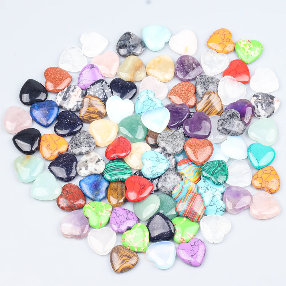 A collection of heart-shaped amethyst crystal stones in various colors and shades.