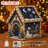 A DIY diamond painting kit of a Christmas cabin house featuring a snowy scene and festive decorations.