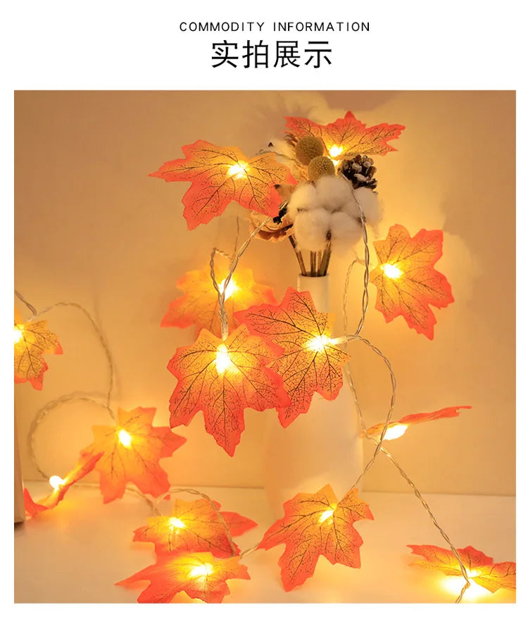 An autumn leaf garland with orange and red leaves illuminated by warm LED lights for fall decoration.