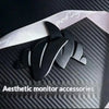 Black 3D printed LED monitor wing decorations set against a dark carbon fiber background.